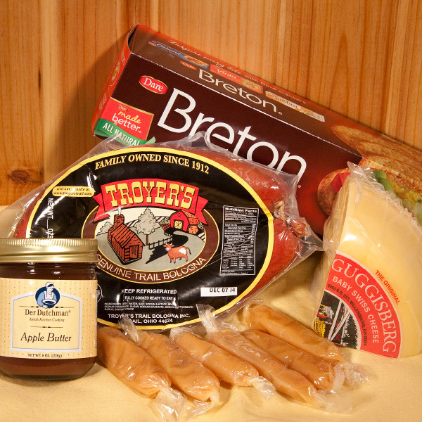 Your Favorites Box contains Amish Country Favorites such as Troyers Trail Bologna, Guggisberg Baby Swiss cheese, Hartmans' Caramels, Der Dutchman Apple Butter and Breton Crackers.