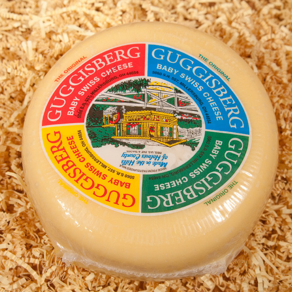 Guggisberg Baby Swiss Cheese is the most popular cheese sold here in Amish Country. A delicious semi-soft cheese with a buttery, subtly sweet flavor. Made with whole milk, its shorter curing time results in smaller "eyes" and a milder nature than traditional Swiss cheese. An excellent choice for snacks, appetizers, sandwiches, fondues and recipes.

4lb Guggisberg Baby Swiss Cheese