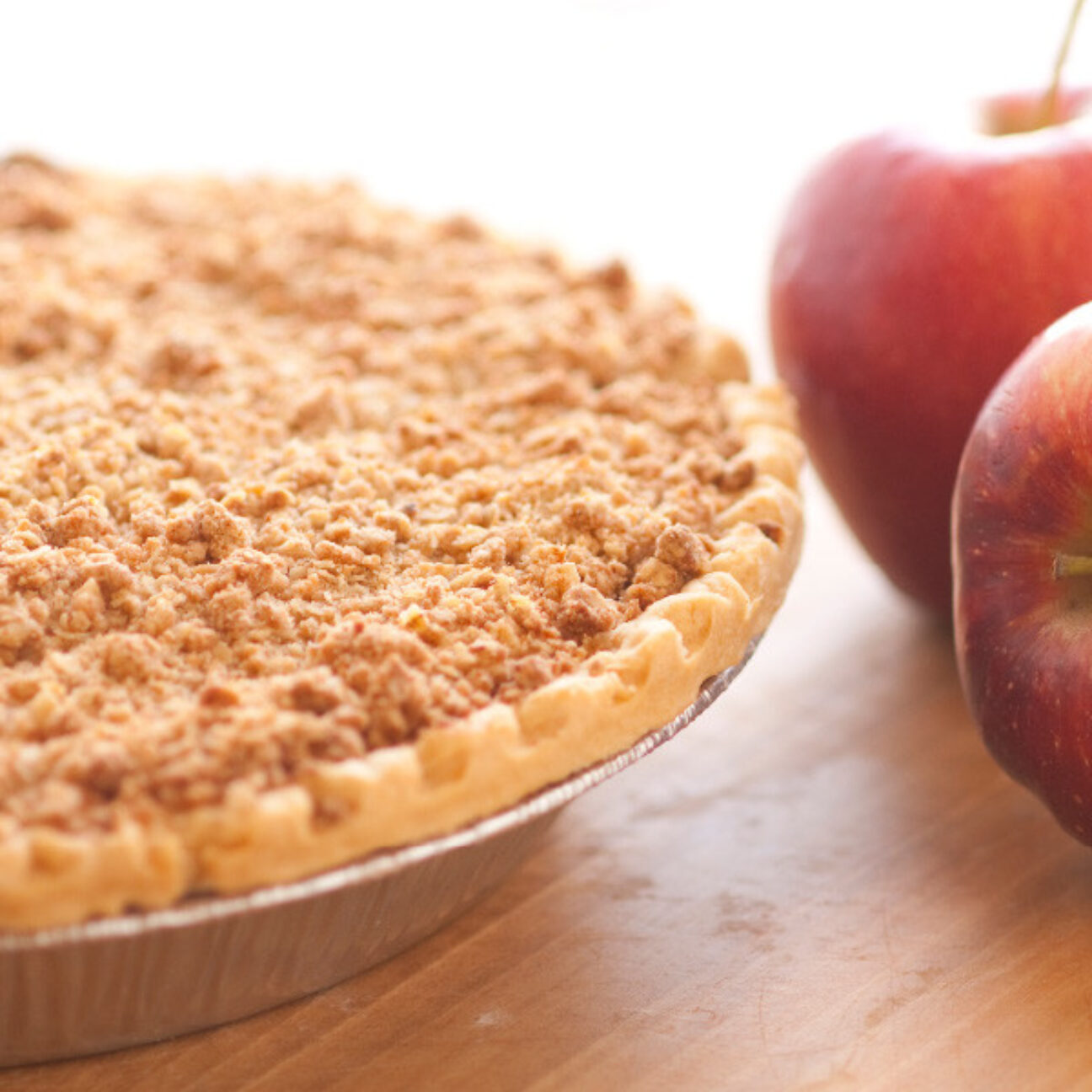 Liberally blended with cinnamon, sweet apples are cooked into a simple but delicious filling then baked in our homemade pie crusts. No artificial flavorings and colorings are used. Generously topped with crumbs for the 