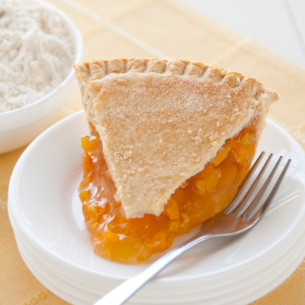 Juicy golden peaches are cooked perfectly in a blonde filling with a delicious result. Our double-crusted fruit pies are lightly brushed with butter and sprinkled with sugar to brown the crust. Pies will arrive pre-baked and frozen in an insulated shipping cooler. Simply thaw in the oven and your home will be filled with the sweet scent of our Amish bakery. Instructions are included.

Available as 9 inch pie. Baked and shipped from Ohio's Amish Country.