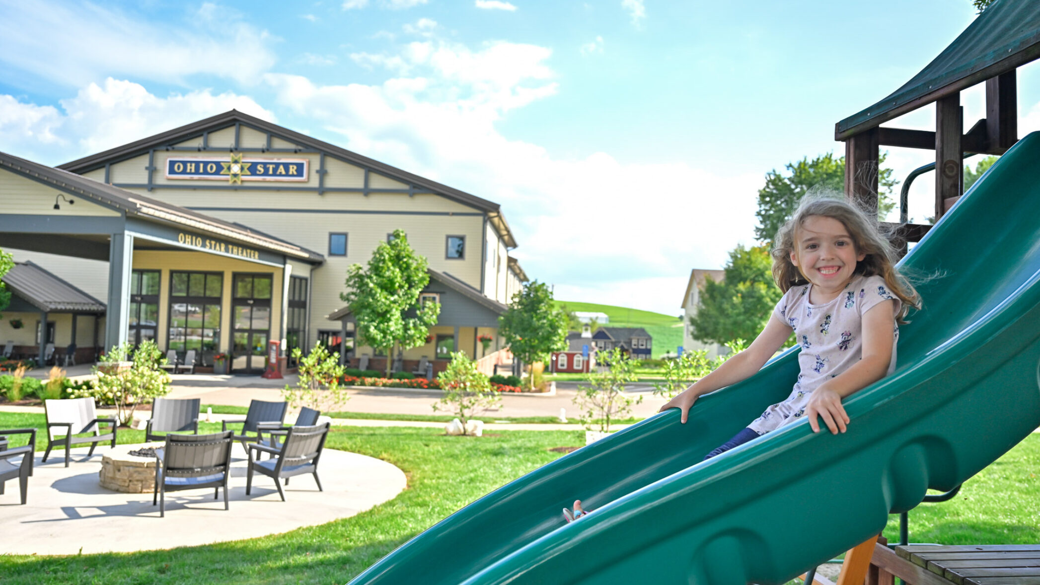 child on slide in front of ohio star theater