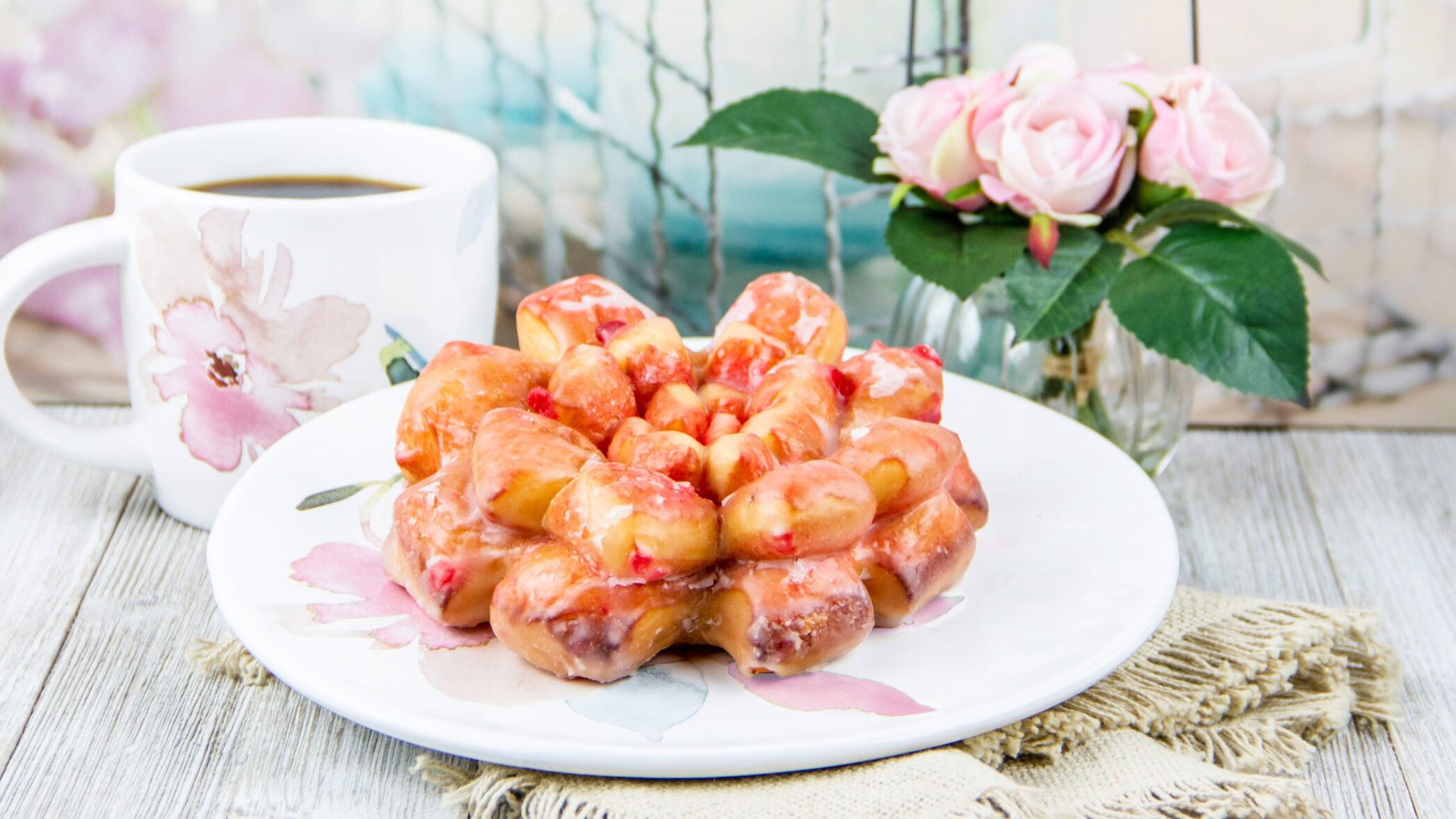 frosted cherry rosebud pastry and coffee