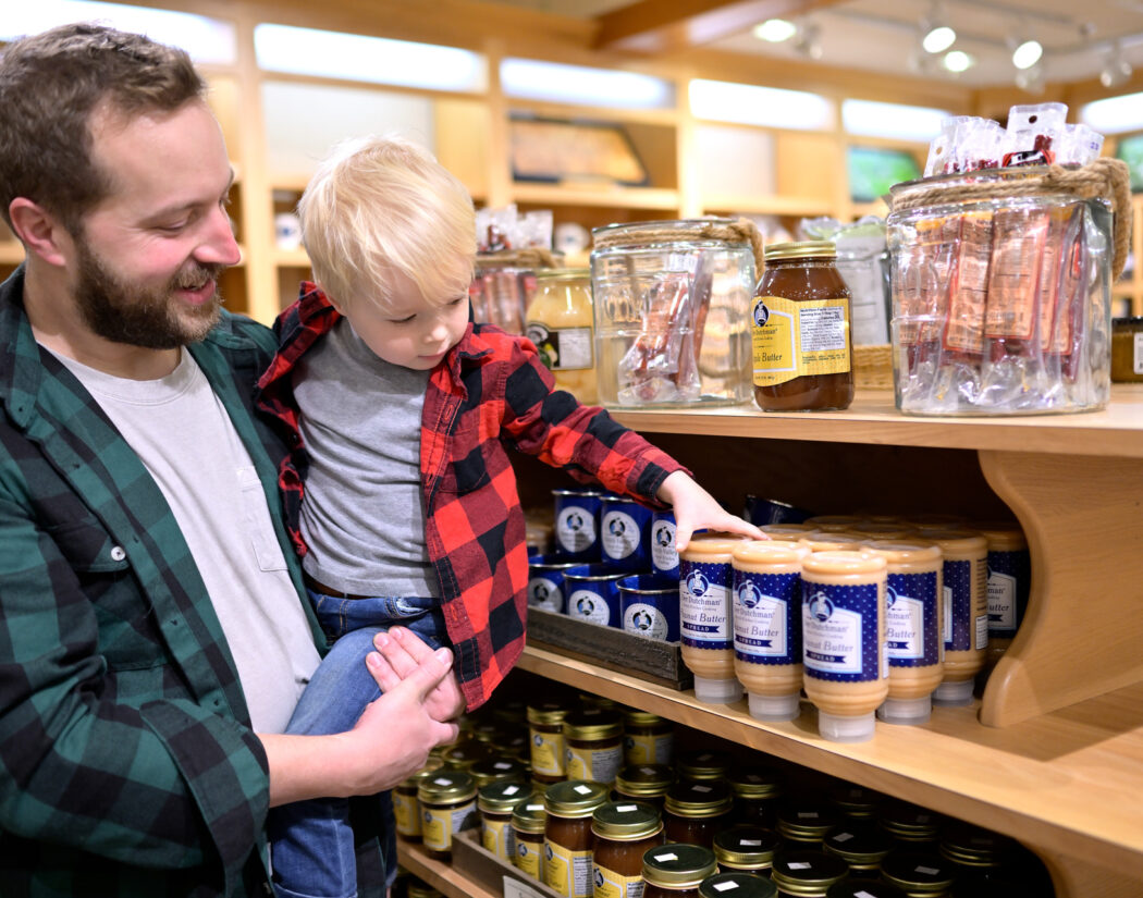 Father and son shopping for nut butters at Der Dutchman