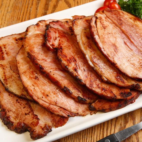 Specially selected and carefully hand-trimmed, our smoked semi-boneless hams are slowly smoked and cooked with natural hickory embers for flavor and tenderness. They are 96% fat free and fully cooked. May be served hot or cold.

Boneless hams will vary in weight - average 8 to 10 lbs. 

Important! Be sure to place your ham in the refrigerator or freezer as soon as you receive it.